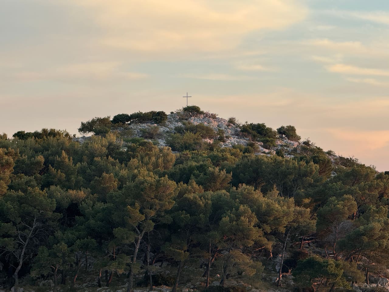 Tree-covered island near Tribunj at dusk